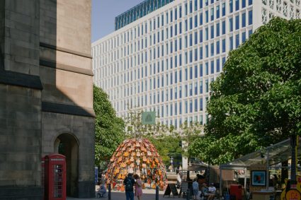 wind-powered sculpture turns donated guitars into sonic art installation in manchester