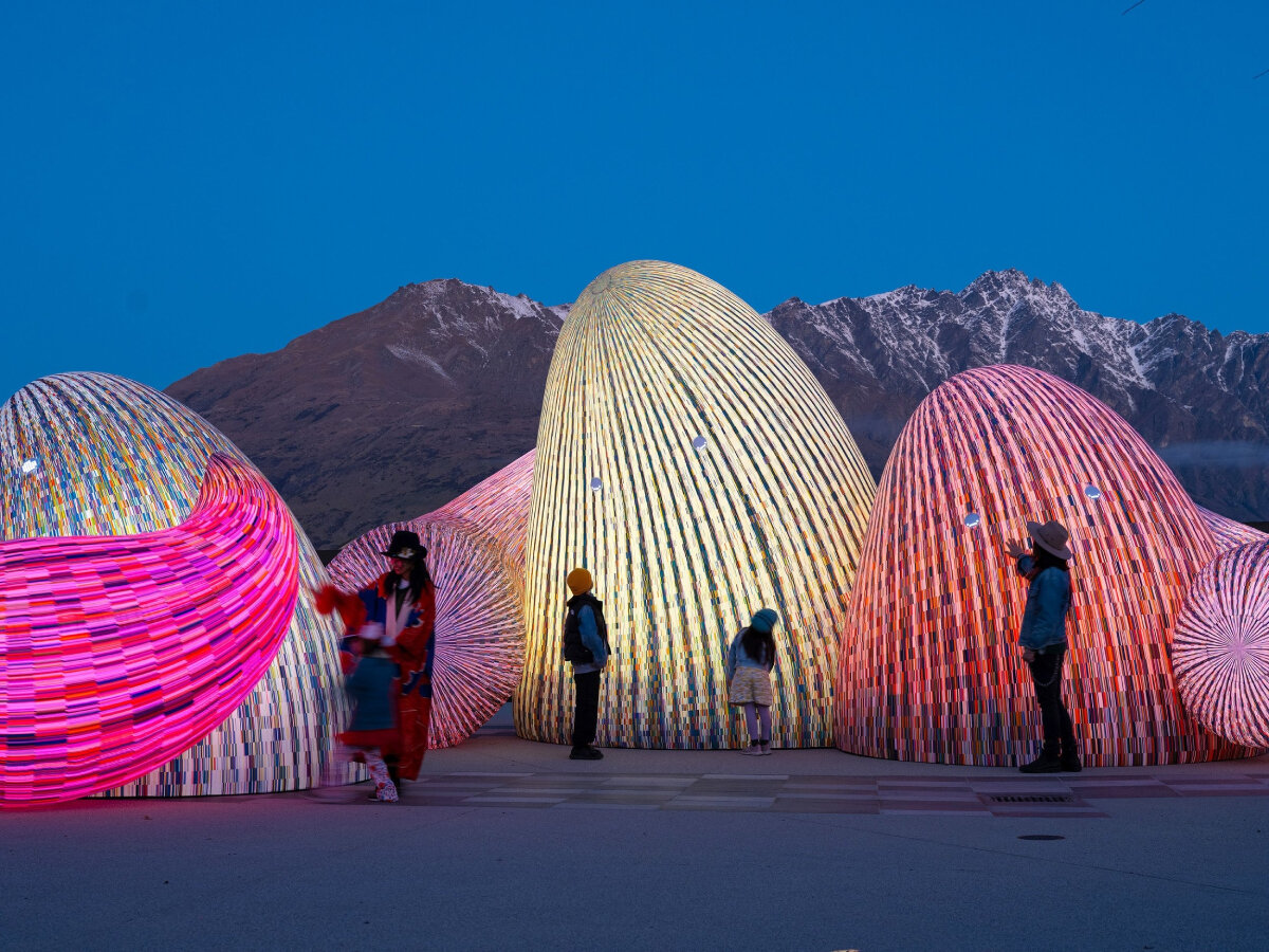 ENESS' glowing, interactive AI oracles question digital futures near new zealand mountains