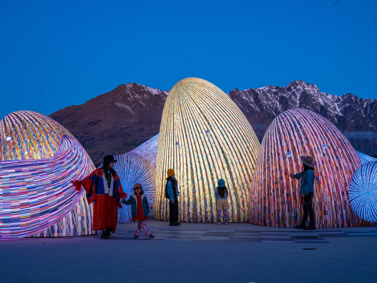 ENESS' glowing, interactive AI oracles question digital futures near new zealand mountains